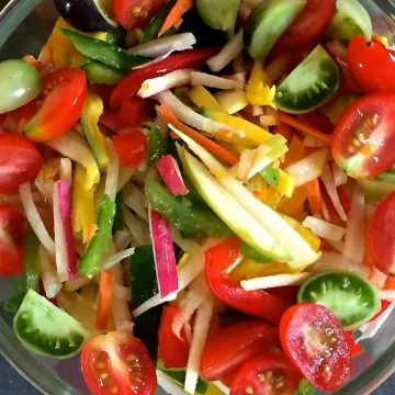 Salad of Radish Tomato Raw Mango in a citrusy ginger dressing