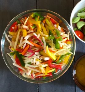 Salad of Radish Tomato Raw Mango in a citrusy ginger dressing