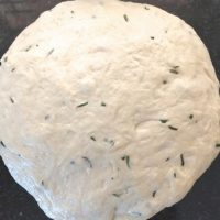 Rosemary flavoured focaccia dough after rising_pepperonpizza.com