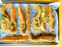 Arrange the herb and parmesan crusted squash on a baking tray