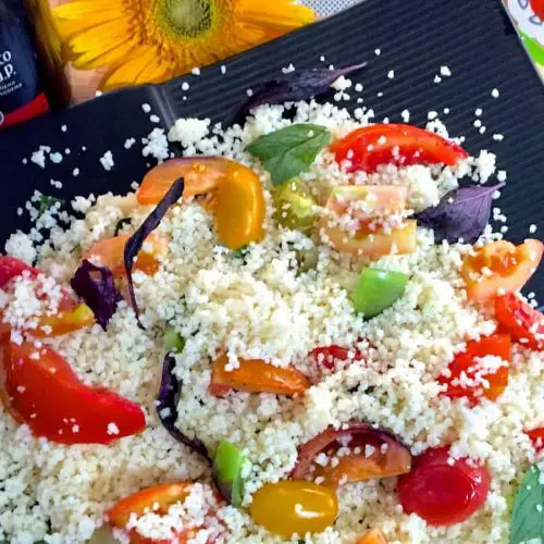 Roasted Tomato Couscous Salad with tomatoes of many colours and sizes, fresh basil, oregano, balsamic vinegar and lemon juice for a healthy refreshing salad