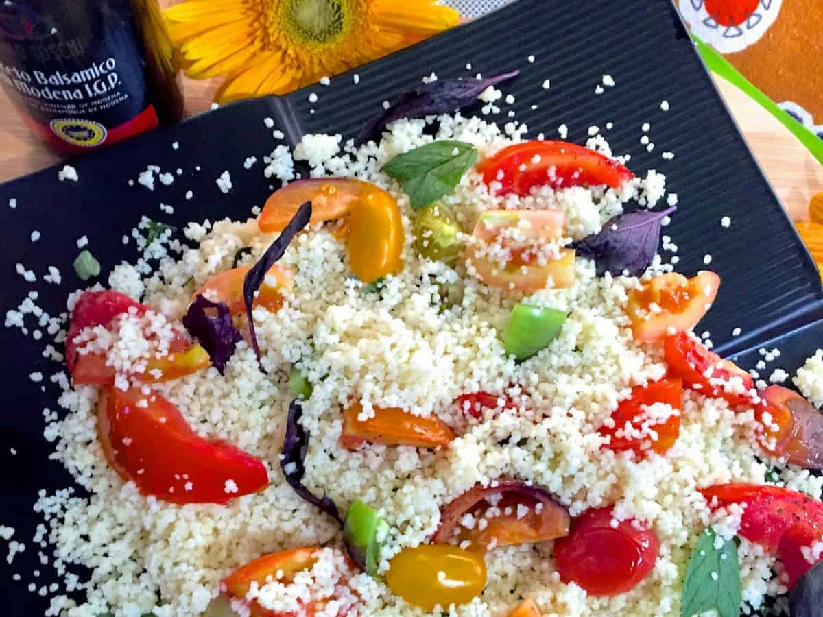 Roasted Tomato Couscous Salad with tomatoes of many colours and sizes, fresh basil, oregano, balsamic vinegar and lemon juice for a healthy refreshing salad