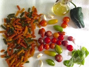 Tomato of different colours and shapes for making burst cherry tomato sauce for pasta