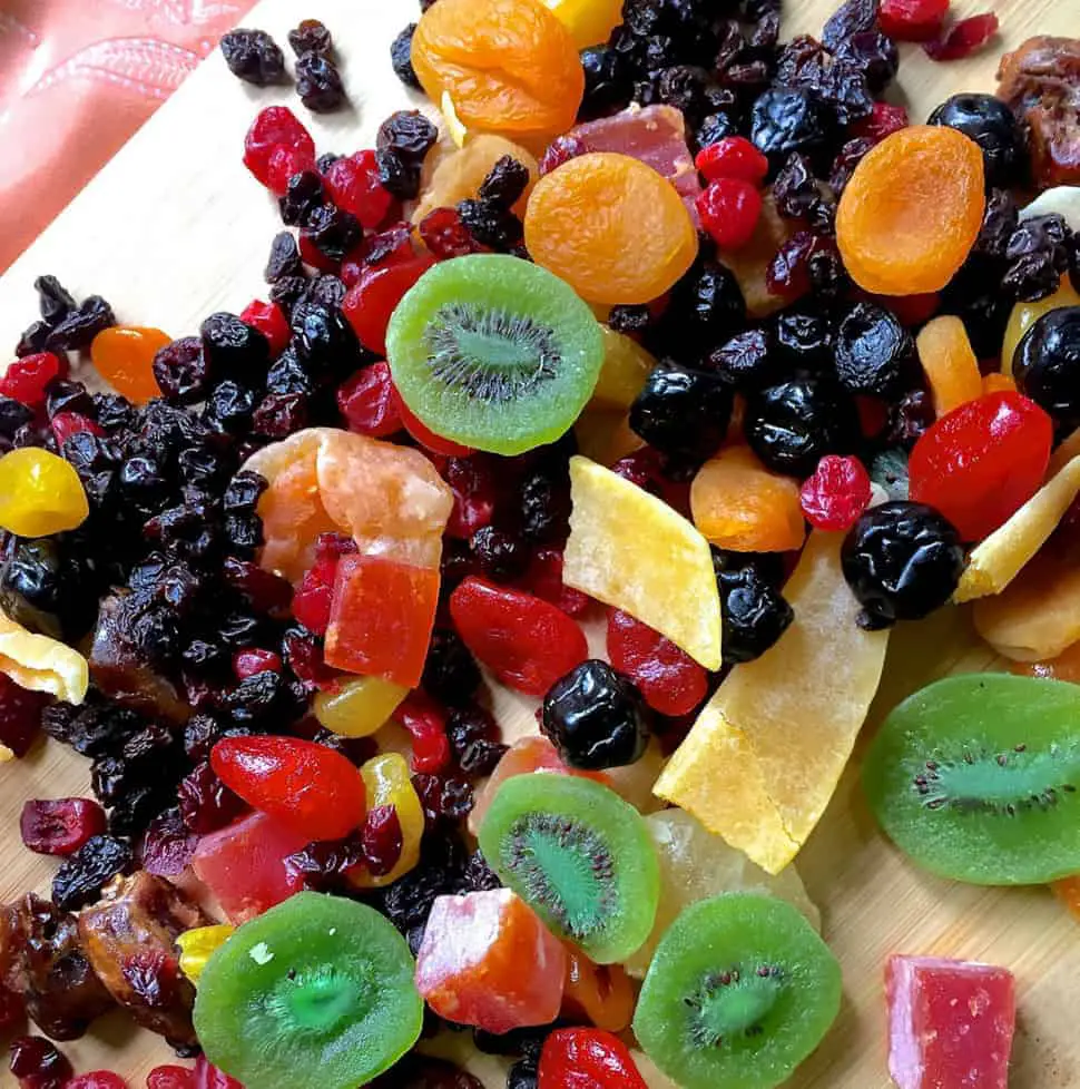 A colourful array of dry fruits read to be cut to soak fruits for Christmas cake