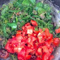 Add tomatoes and greens