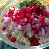 Toss the veggies together with lemon juice and salt and garnish with pomegranates