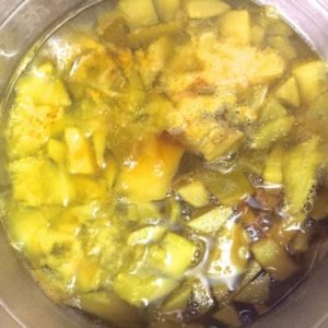 Step 5 to make Raw Mango Pachadi: Add jaggery water to the cooked mango