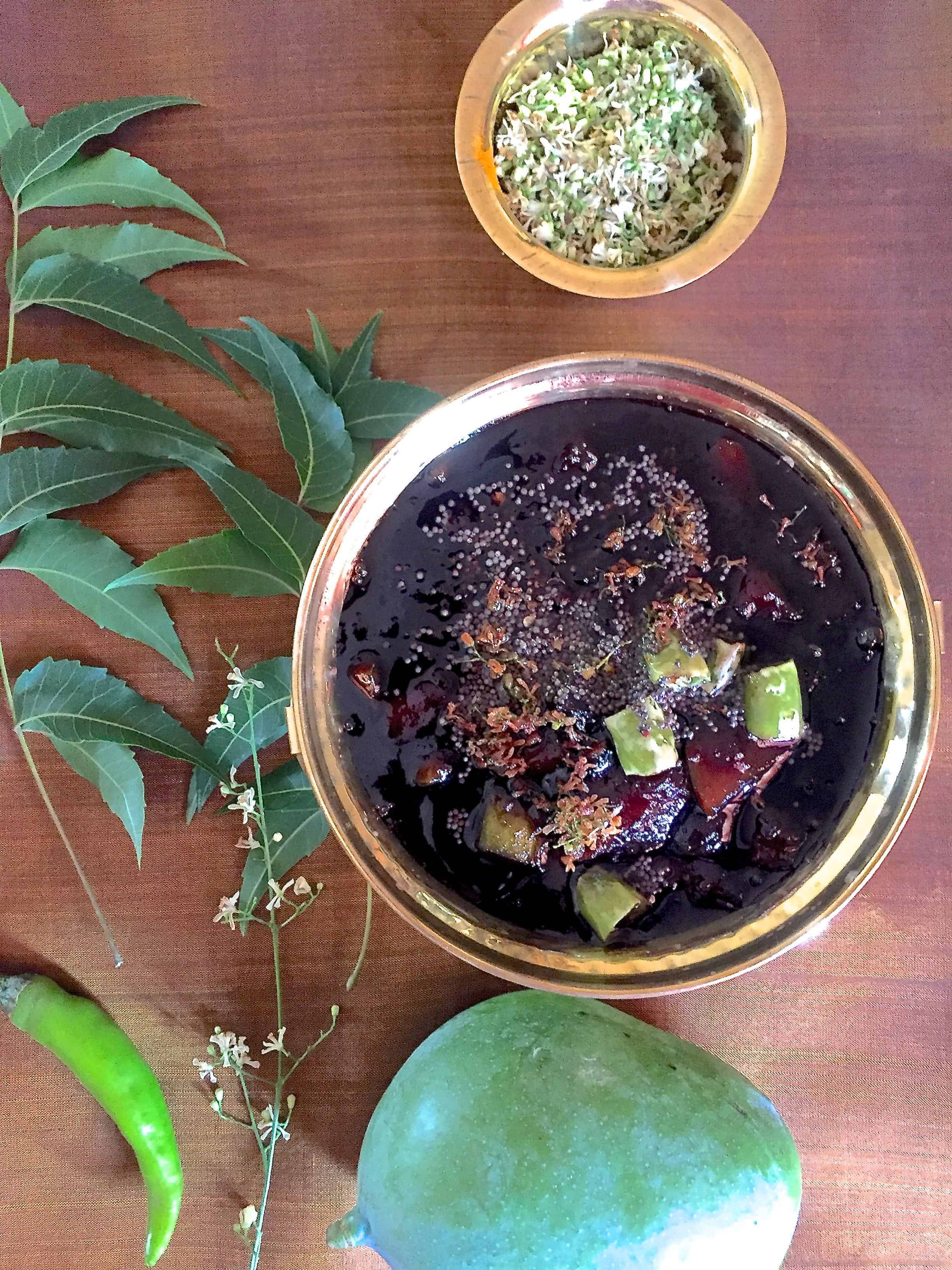 Seasonal unripe mango, fresh neem flowers, chilli and Jaggery cooked together into a Raw mango pachadi