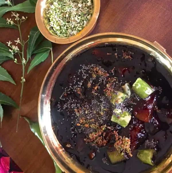 Raw Mango Neem Flower Pachadi_Im1_970x978 Raw Mango Pachadi for Tamil New Years Day in a brass bowl with a tempering of chilies and mustard seeds and garnish of Neem flowers