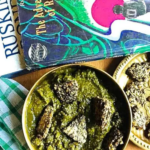 Split Urad dal vadi in spinach gravy, Sepu vadi, a spiced spinach and dill gravy with fried black gram lentil fritters, is a traditional curry from Himachal Pradesh in Northern India