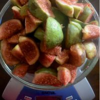 Sliced green fresh figs being weighed for homemade fig jam