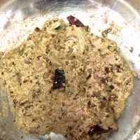 Adding coconut cumin and coriander paste to the gravy for bamboo curry