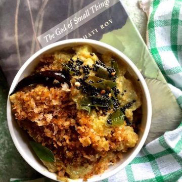 A bowl of Raw Banana Varutha Erissery, a curry of green plantain cooked in turmeric and roasted coconut paste