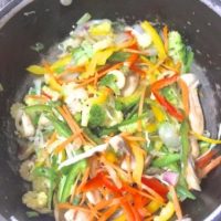 Add the vegetables for stir fry one by one and toss