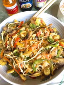 Easy to make stir fried vegetable noodles in a large bowl with chopsticks on the ready