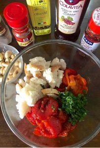 Ingredients ready for making Spanish Romesco Sauce -Roasted peppers, Tomatoes, bread, almonds, vinegar, chilli pepper flakes, smoked paprika, Olive oil, garlic, Parsley