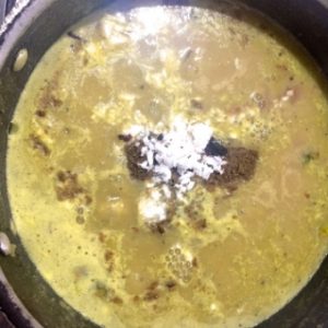 Seasoning Maharashtrian Amti Dal with Goda Masala, kokum and coconut