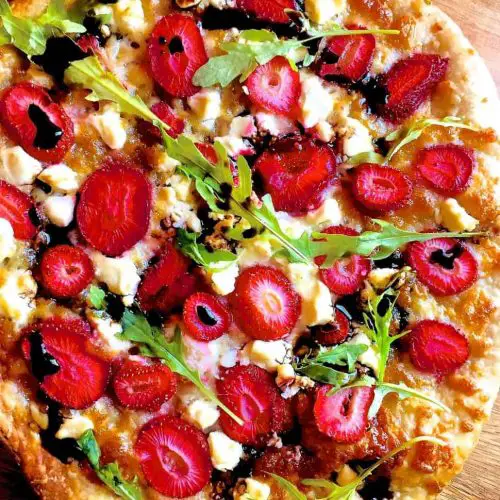 Strawberry Pizza with Goat Cheese , Mozzarella and Balsamic Reduction as well as Basil or Arugula/ Rocket leaves