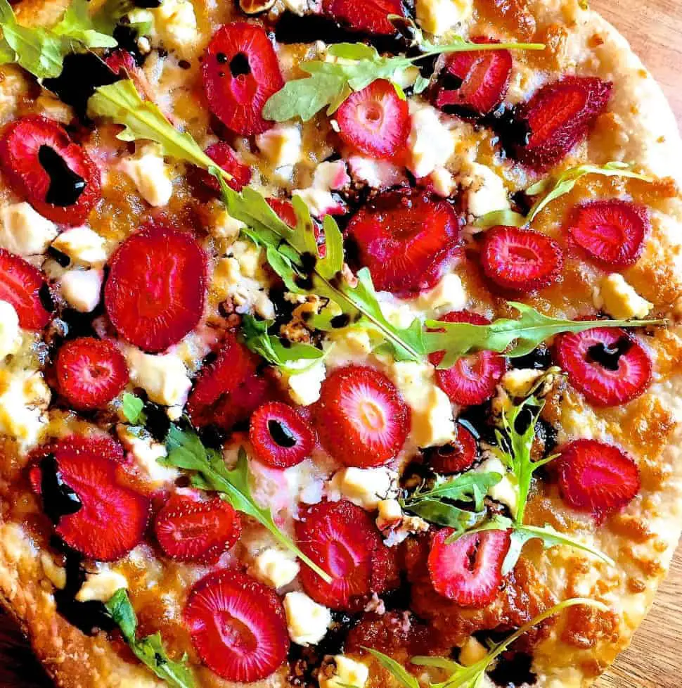 Strawberry Pizza with Goat Cheese , Mozzarella and Balsamic Reduction as well as Basil or Arugula/ Rocket leaves