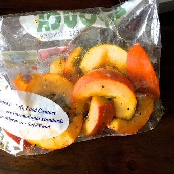 Process Shot 1: Shake the pumpkin slices in olive oil, rosemary and seasonings, in a closed zip lock bag