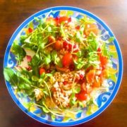 Process 9: Finishing the salad preparation with pomegranate arils and sunflower microgreens