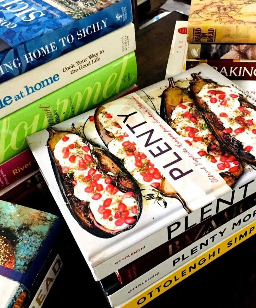 Sets of cookbooks stacked near each other